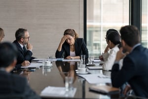 Female Leader Struggles to Address Team During Crisis Meeting